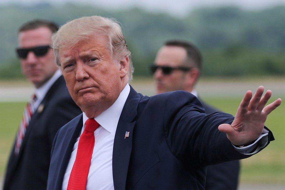 FILE PHOTO  U S  President Donald Trump returns waves after arriving in Morristown  New Jersey  U S   July 5  2019  REUTERS Jonathan Ernst File Photo