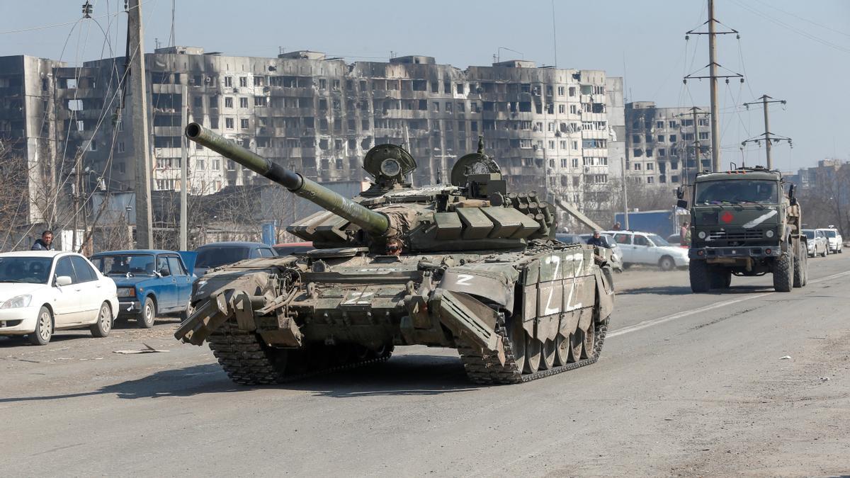 A tank of pro-Russian troops drives in a street in Mariupol