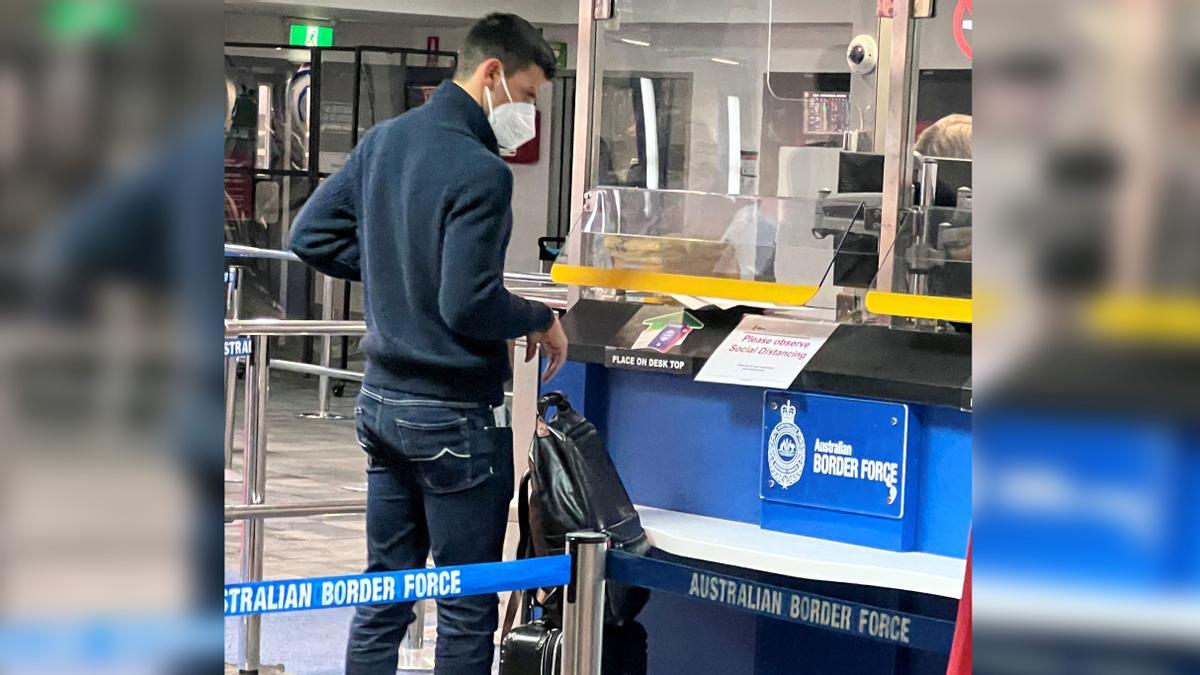 Serbian tennis player Novak Djokovic stands at a booth of the Australian Border Force at the airport in Melbourne, Australia, January 5, 2022. Picture taken January 5, 2022, in this photograph obtained January 6, 2022. via REUTERS ATTENTION EDITORS - THIS IMAGE HAS BEEN SUPPLIED BY A THIRD PARTY.