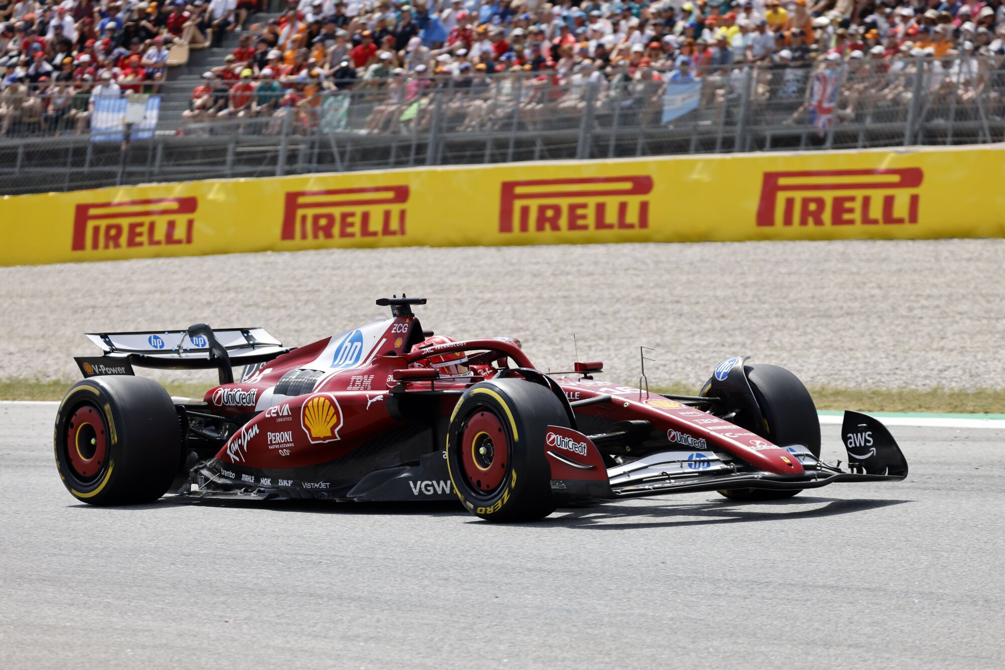Ferrari driver Charles Leclerc of Monaco steers his car during the Spanish Grand Prix Formula One race at the Barcelona Catalunya racetrack in Montmelo, near Barcelona, Spain, Sunday, June 1, 2025. (AP Photo/Joan Monfort)
