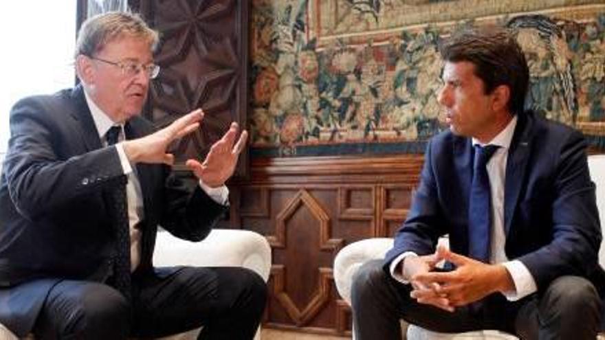 El presidente de la Generalitat, Ximo Puig, junto a Carlos Mazón durante un encuentro reciente.