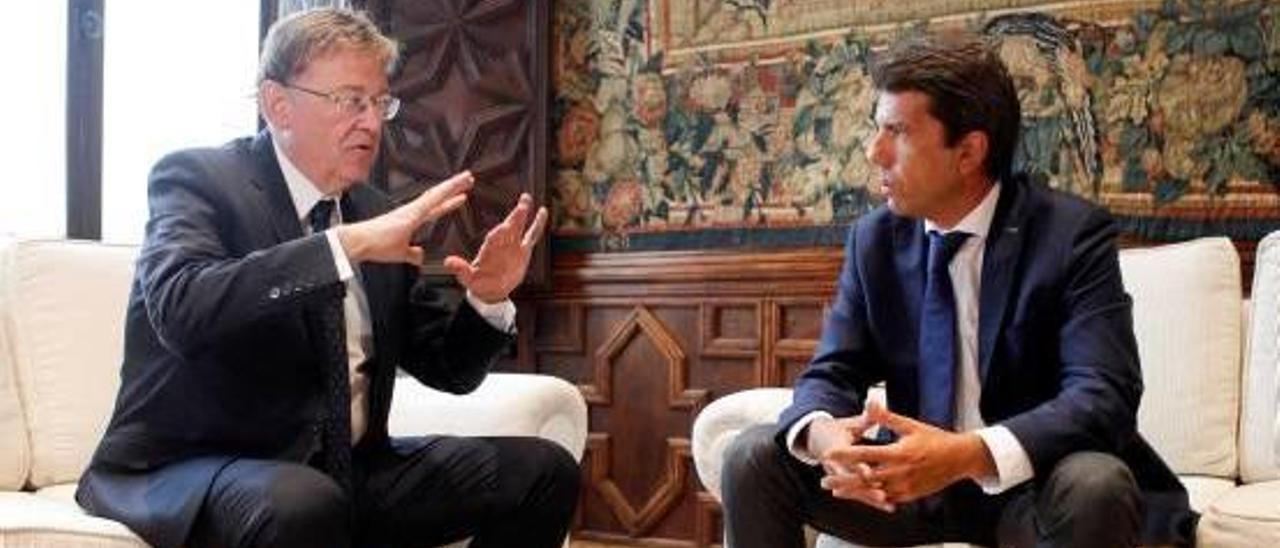 El presidente de la Generalitat, Ximo Puig, junto a Carlos Mazón durante un encuentro reciente.