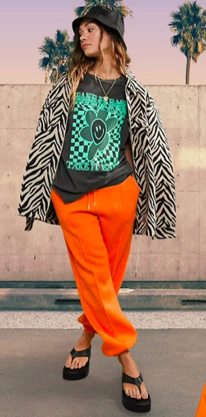 Joggers extragrandes naranjas con jaretas de ASOS DESIGN
