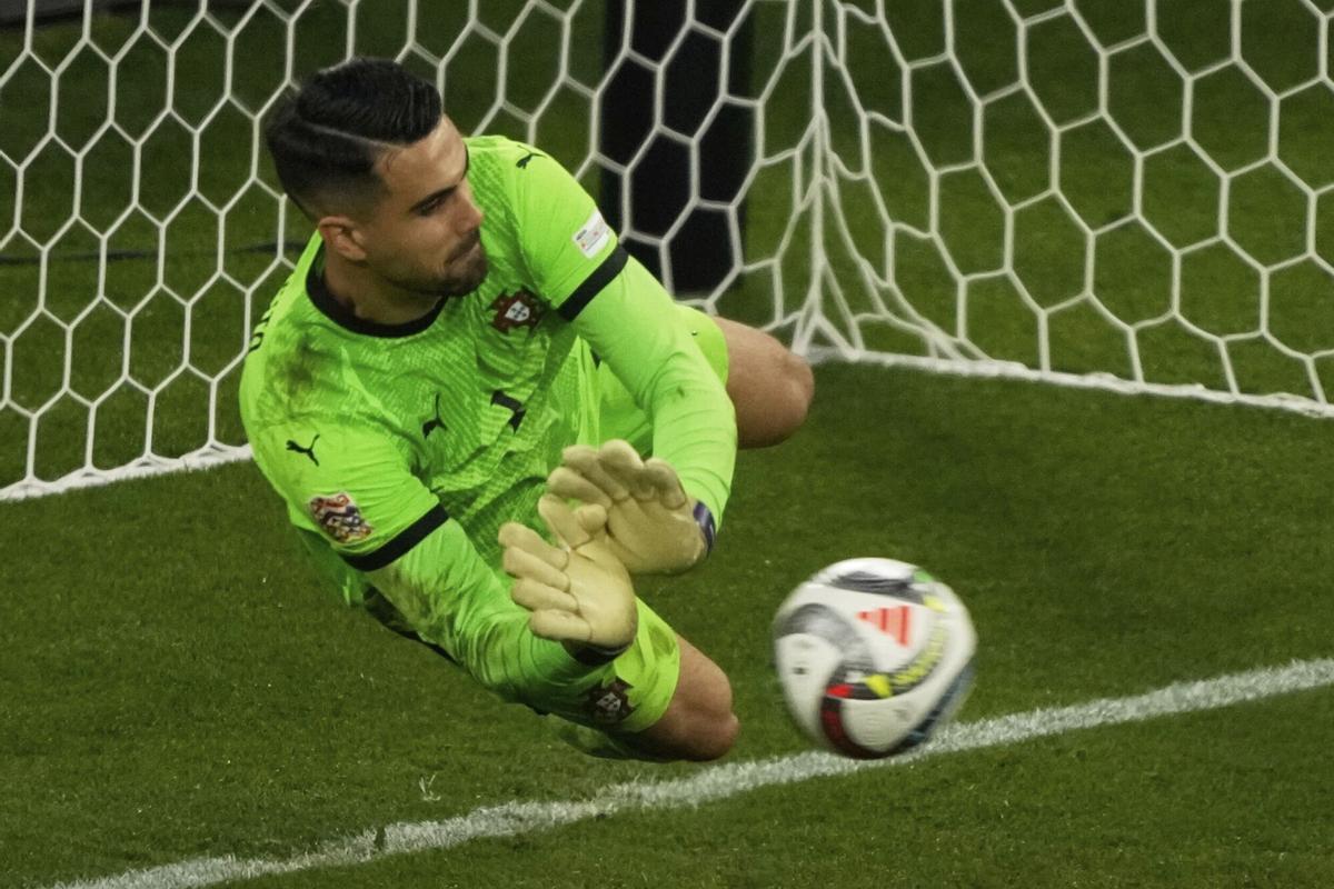 Portugal goalkeeper Diogo Costa stops a penalty shot by Spain's Alvaro Morata during the Nations League final soccer match between Portugal and Spain at the Allianz Arena in Munich, Germany, Sunday, June 8, 2025. (AP Photo/Michael Probst)