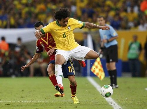 Brazil's Marcelo fights for the ball with Spain's Pedro during their Confederations Cup final soccer match at the Estadio Maracana in Rio de Janeiro