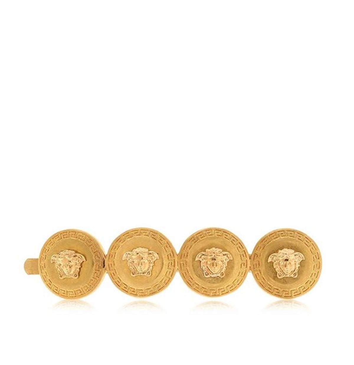 Horquilla con forma de monedas metálicas, de Versace