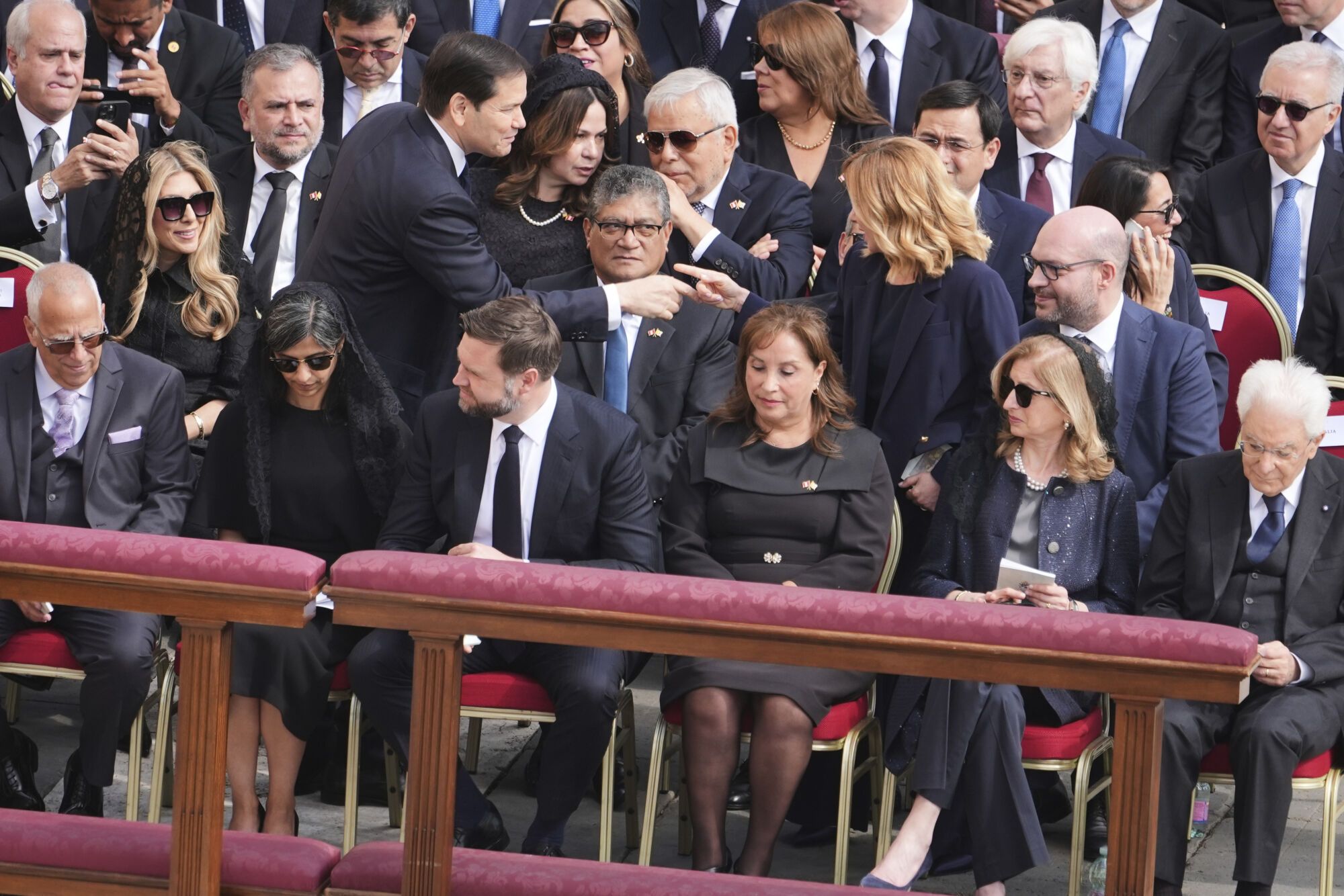 Secretary of State Marco Rubio, center left, speaks with Italy's Prime Minister Giorgia Meloni, center right, prior to the inaugural Mass of Pope Leo XIV's pontificate in St. Peter's Square at the Vatican, Sunday, May 18, 2025. (AP Photo/Jacquelyn Martin, Pool). POOL PHOTO