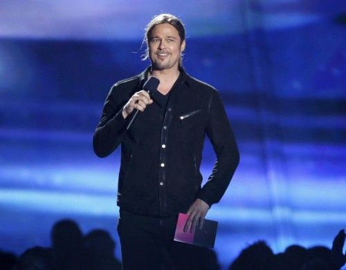 Actor Brad Pitt presents the award for movie of the year at the 2013 MTV Movie Awards in Culver City, California