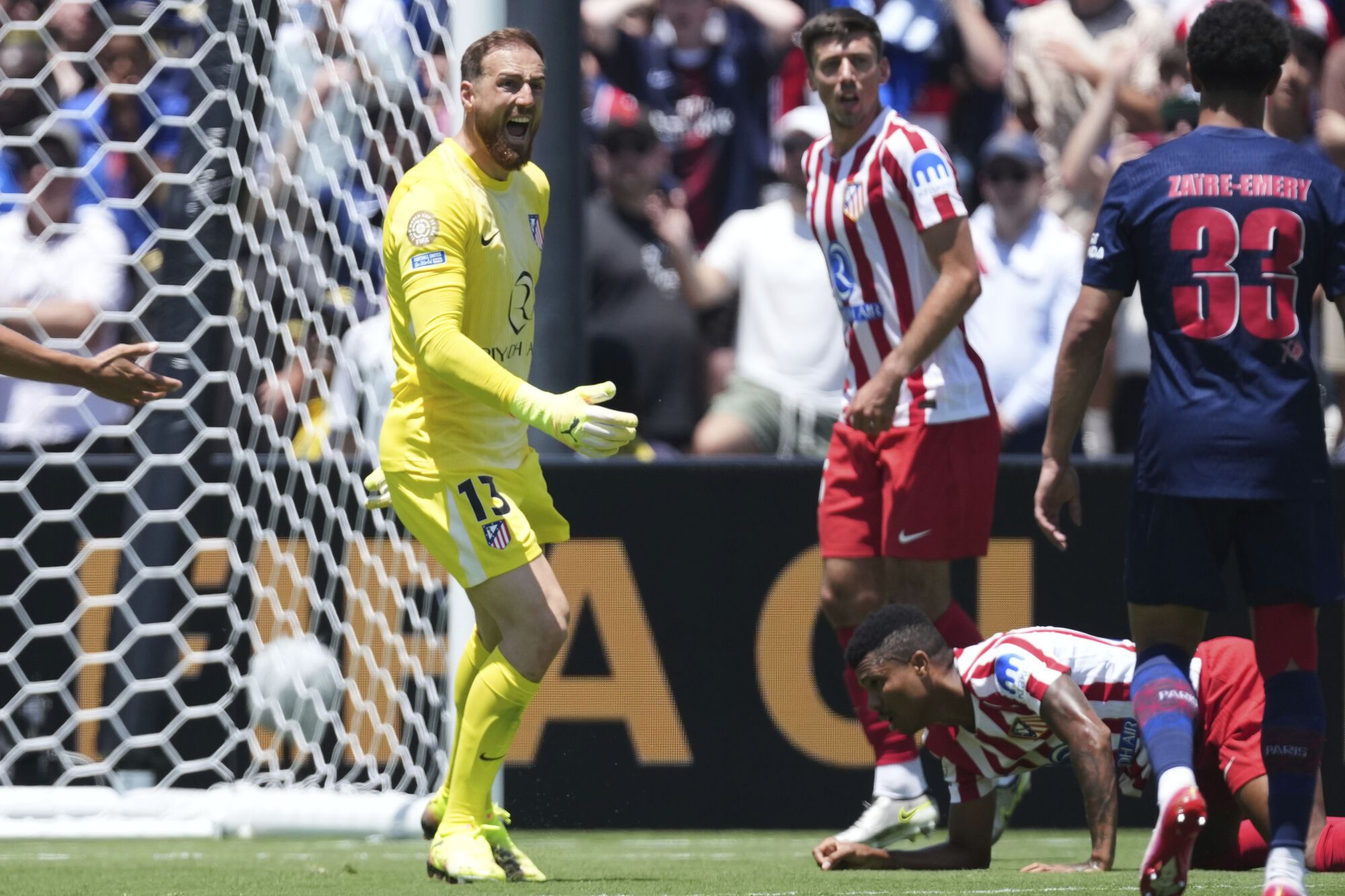 Atletico Madrid's goalkeeper Jan Oblak (13) reacts during the Club World Cup group B soccer match between PSG and Atletico Madrid in Pasadena, Calif., Sunday, June 15, 2025. (AP Photo/Jae Hong)