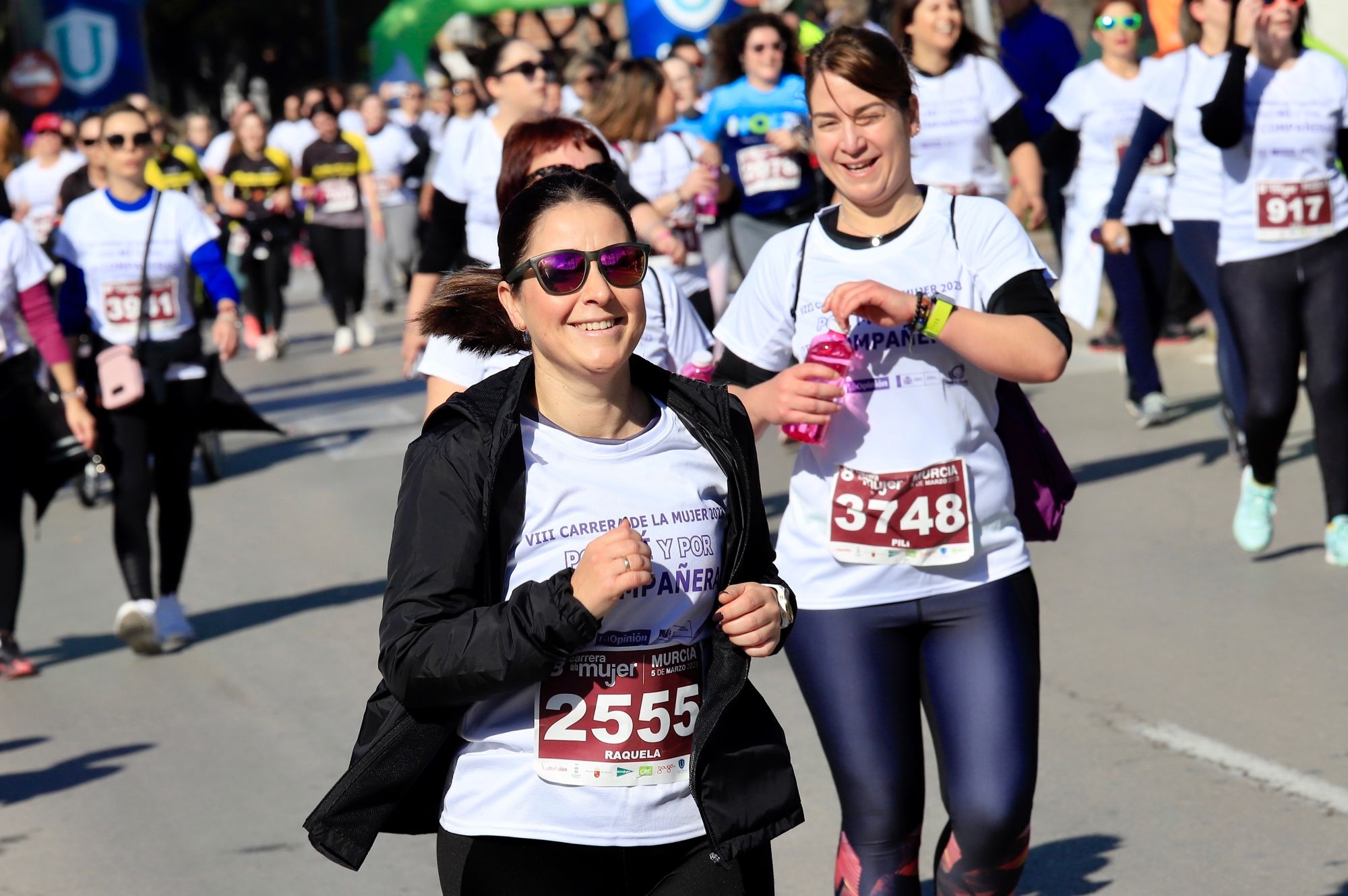 La salida y el recorrido de la Carrera de la Mujer 'inmortalizados' en imágenes