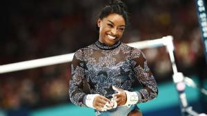 epa11502938 Simone Biles of USA reacts after performing on the Uneven Bars at the Womens Qualification of the Artistic Gymnastics competitions in the Paris 2024 Olympic Games, at the Bercy Arena in Paris, France, 28 July 2024. EPA/ANNA SZILAGYI