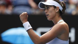 Spain’s Garbine Muguruza reacts after defeating Kiki Bertens of the Netherlands in their fourth round singles match at the Australian Open tennis championship in Melbourne, Australia, Monday, Jan. 27, 2020. (AP Photo/Andy Wong)