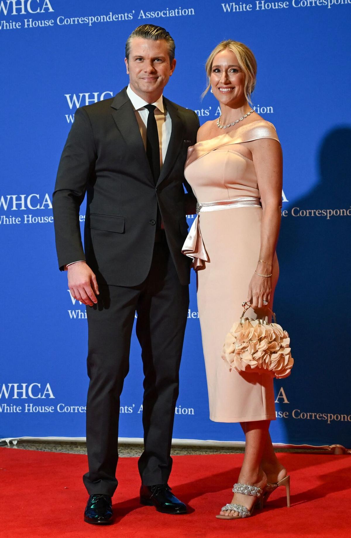 US Secretary of Defense Pete Hegseth (L) and wife Jennifer Rauchet attend the White House Correspondents' dinner at the Washington Hilton in Washington, DC, on April 25, 2026. US President Donald Trump is attending the annual gala of the political press for the first time while in office. (Photo by Alex WROBLEWSKI / AFP)