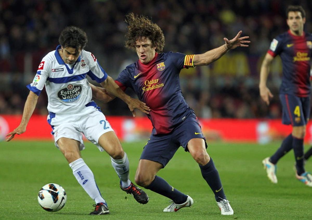 Puyol frena l’avanç de Valerón en el Barça-Depor del 9 de març. Puyol frena l’avanç de Valerón en el Barça-Depor del 9 de març.