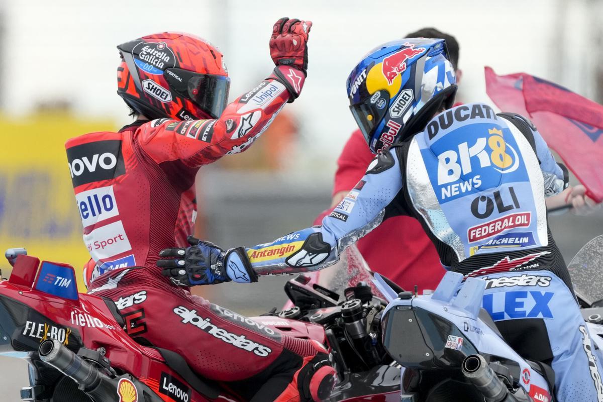 MotoGP race winner Spains Marc Marquez of the Ducati Lenovo Team, left, celebrates with second place Spains Alex Marquez of the BK8 Gresini Racing MotoGP Team in Termas de Rio Hondo circuit, Argentina, Sunday, March 16, 2025. (AP Photo/Gustavo Garello) MotoGP race winner Spains Marc Marquez of the Ducati Lenovo Team, left, celebrates with second place Spains Alex Marquez of the BK8 Gresini Racing MotoGP Team in Termas de Rio Hondo circuit, Argentina, Sunday, March 16, 2025. (AP Photo/Gustavo Garello)