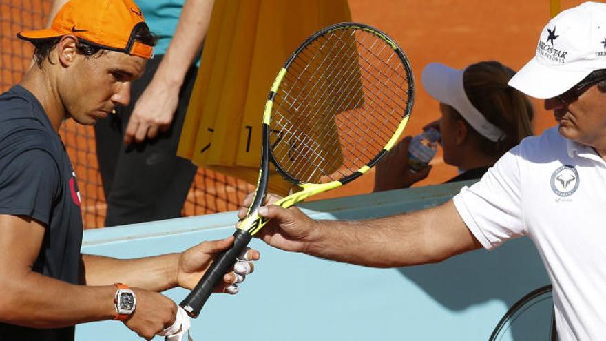 Rafa Nadal y su tío Toni, en un entrenamiento en Madrid.