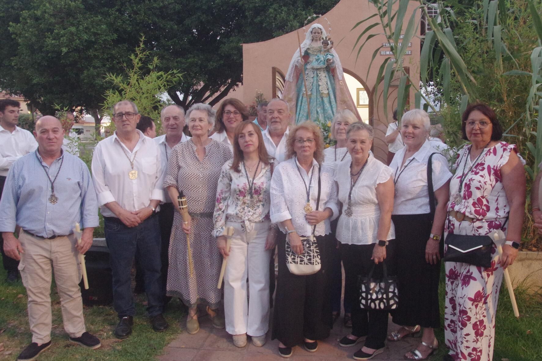 Traslado con antorchas de la Virgen de las Cañas a la parroquia de Nuestra Señora de los Dolores, en el Puerto de la Torre