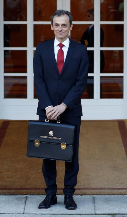 Spain's Prime Minister Pedro Sanchez holds his ...