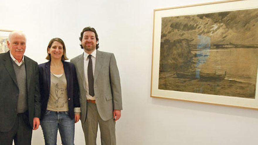 El ´batle´ Nadal Torres y los comisarios, junto a una obra de Meifrén.