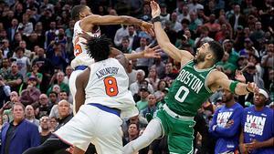 Boston, MA - May 7 - Mikal Bridges #25 and OG Anunoby #8 of the New York Knicks shut down Jayson Tatum #0 of the Boston Celtics in the last second, allowing the Knicks to win Game 2 of the Eastern Conference semifinals at the Garden.  (Photo by Matt Stone/MediaNews Group/Boston Herald via Getty Images)