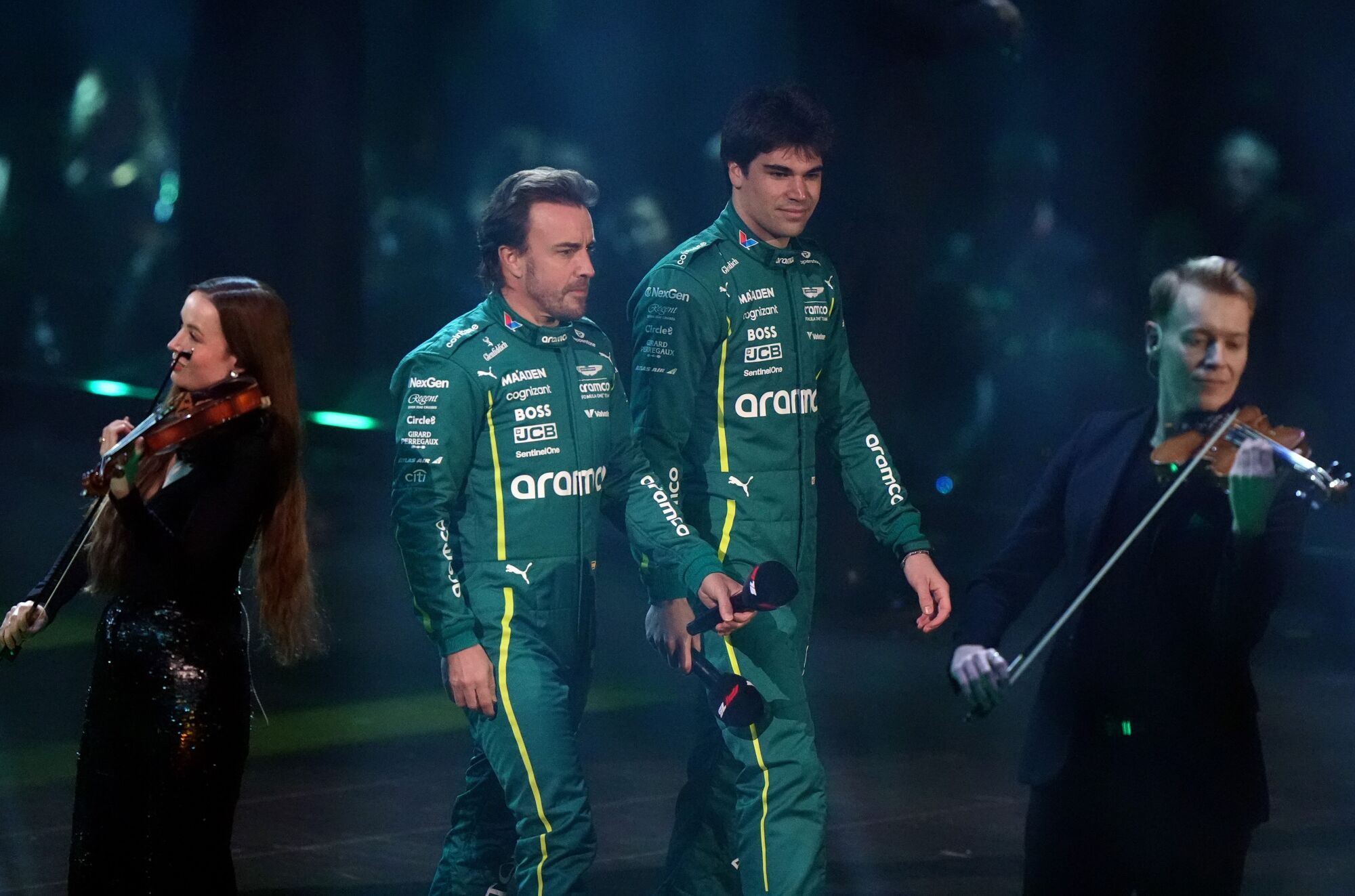 18 February 2025, United Kingdom, London: Aston Martin drivers Fernando Alonso and Lance Stroll unveil their livery for the 2025 season during the F1 75 Live launch event at The O2 arena. Photo: Bradley Collyer/PA Wire/dpa 18/02/2025 ONLY FOR USE IN SPAIN. Bradley Collyer/PA Wire/dpa;motor rallying;motorsport;sports;sports event;F1 75 Live launch event in London