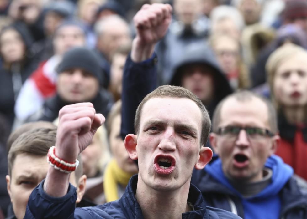 People shout slogans during May Day rally held ...