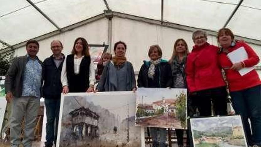 Ganadores y organización, con las obras.