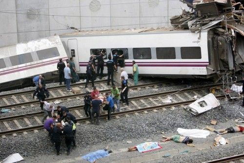 Rescue workers pull victims from a train crash near Santiago de Compostela