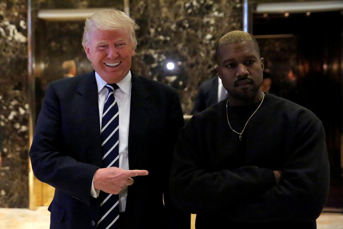 U.S. President-elect Donald Trump and musician Kanye West pose for media at Trump Tower in Manhattan, New York City, U.S., December 13, 2016.  REUTERS/Andrew Kelly      TPX IMAGES OF THE DAY