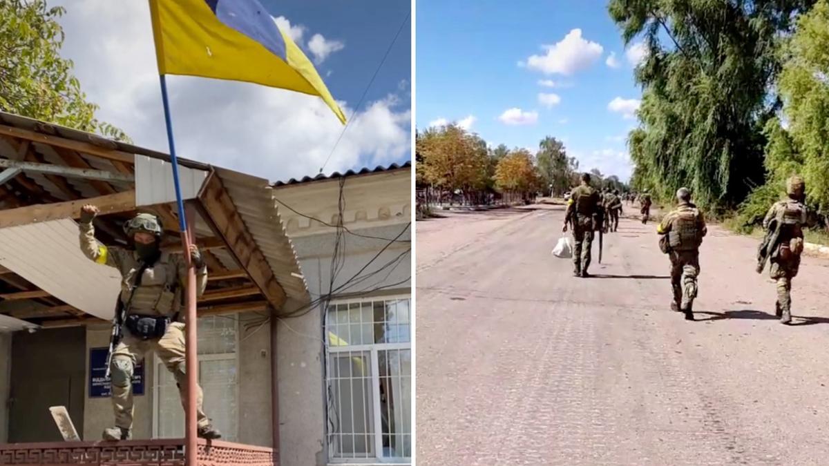 A Ukrainian solider hoists the national flag on a porch in Vysokopillya, Kherson region, Ukraine in this still image from social media video obtained September 6, 2022. TikTok/ta_za_sho00 via REUTERS