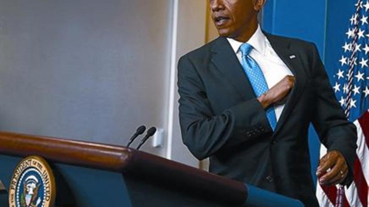 Barack Obama, a su llegada, ayer, a la rueda de prensa.