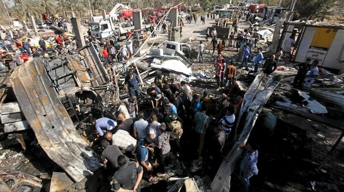 kamor33073673 residents gather at the site of a bomb attack at a160306151307