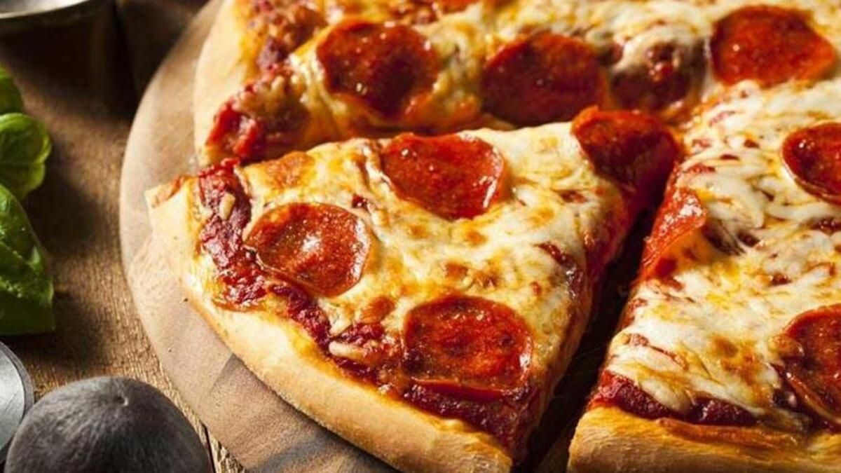 Disfruta de una porción gratis de pizza en Telepizza.