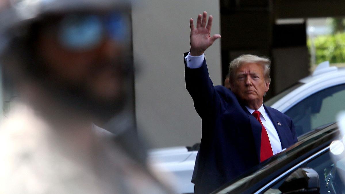 MIAMI, FLORIDA - JUNE 13: Former U.S. President Donald Trump waves as he makes a visit to the Cuban restaurant Versailles after he appeared for his arraignment on June 13, 2023 in Miami, Florida. Trump pleaded not guilty to 37 federal charges including possession of national security documents after leaving office, obstruction, and making false statements. Alon Skuy/Getty Images/AFP (Photo by Alon Skuy / GETTY IMAGES NORTH AMERICA / Getty Images via AFP)
