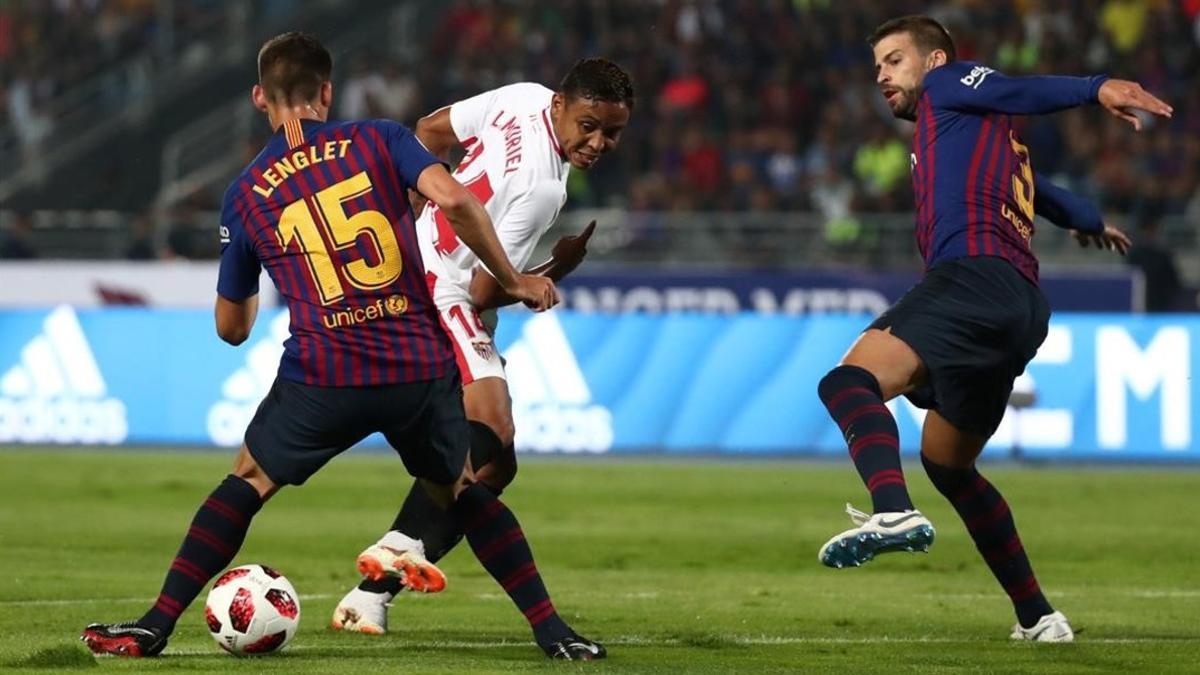 Lenglet y Muriel, en una acción del partido.