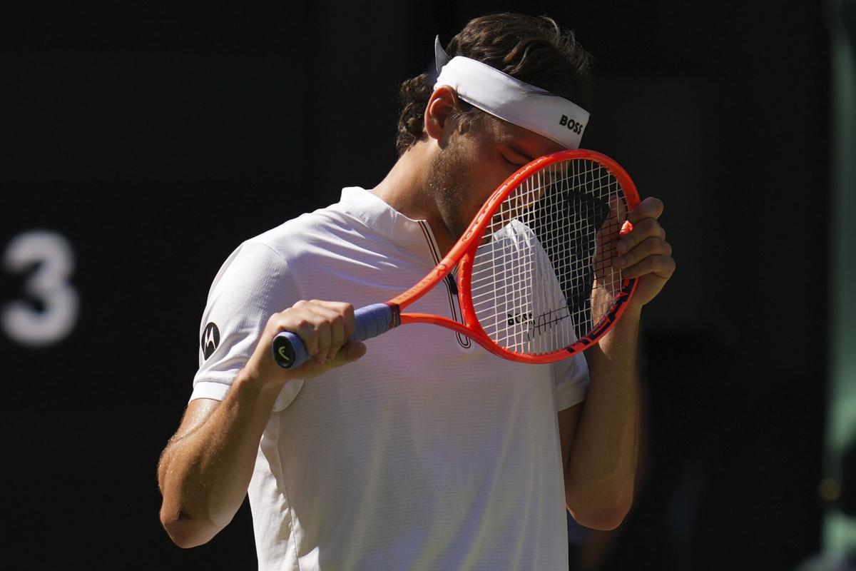 Taylor Fritz of the U.S. reacts during the men's semifinal singles match against Carlos Alcaraz of Spain at the Wimbledon Tennis Championships in London, Friday, July 11, 2025.(AP Photo/Kirsty Wigglesworth)