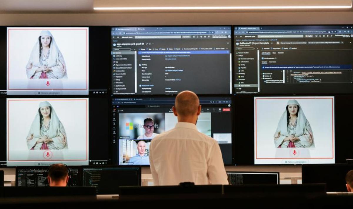 Expertos albaneses trabajan en la Agencia Nacional para la Sociedad de la Información, mientras en las pantallas aparece “Diella”, una “ministra” de inteligencia artificial cuyo nombre significa “Sol” en albanés.