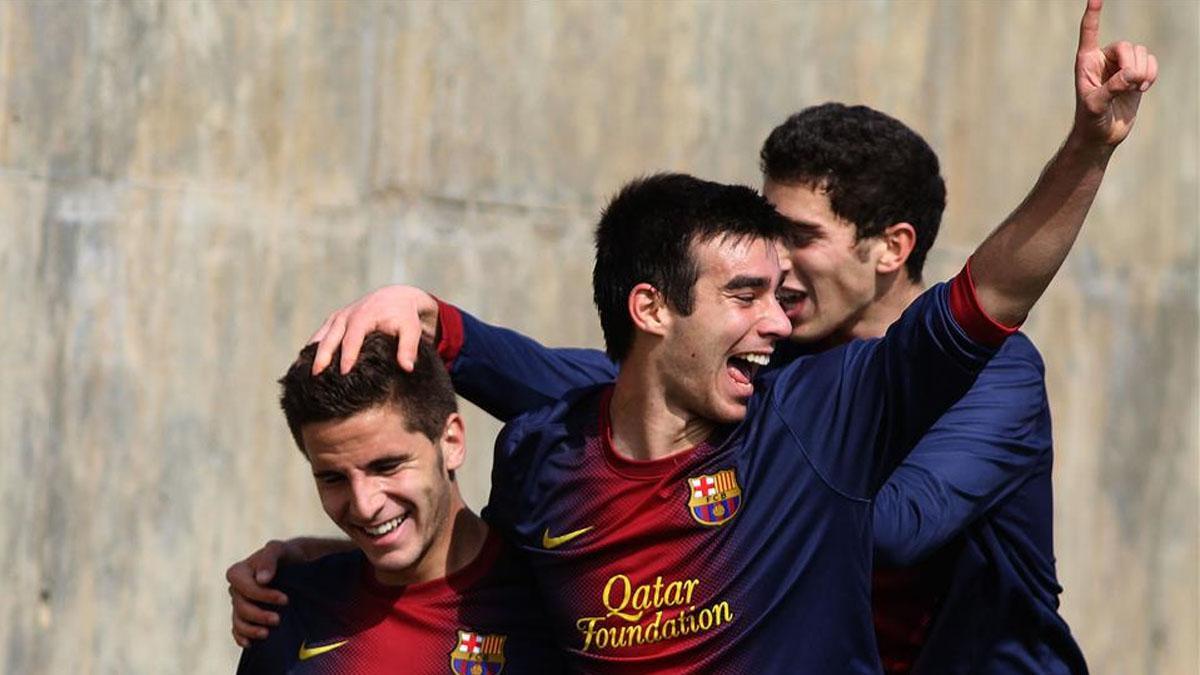 Roger Riera celebra un gol de la Divivión de Honor Juvenil junto a Robet Costa y Pol Calvet la temporada 2012-2013