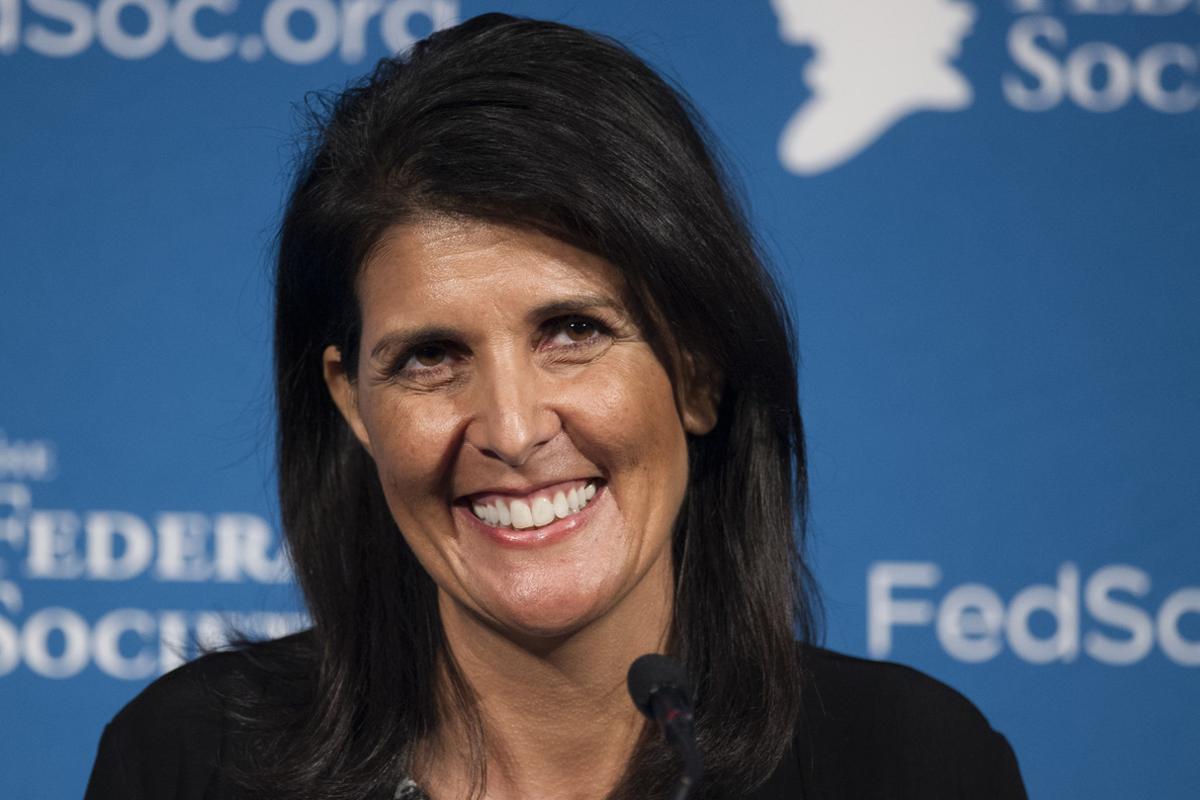 FILE - In this Friday, Nov. 18, 2016 photo, South Carolina Gov. Nikki Haley smiles while speaking at the Federalist Society’s National Lawyers Convention in Washington. President-elect Donald Trump has chosen Haley as U.S. ambassador to the United Nations, and he will treat the ambassadorship as a Cabinet-level position, according to two sources familiar with Trump’s decision who requested anonymity to discuss the decision and its announcement. Haley, an outspoken Trump critic throughout much of the presidential race, would become his first female - and first nonwhite - Cabinet-level official if confirmed by the Senate. (AP Photo/Cliff Owen, File)