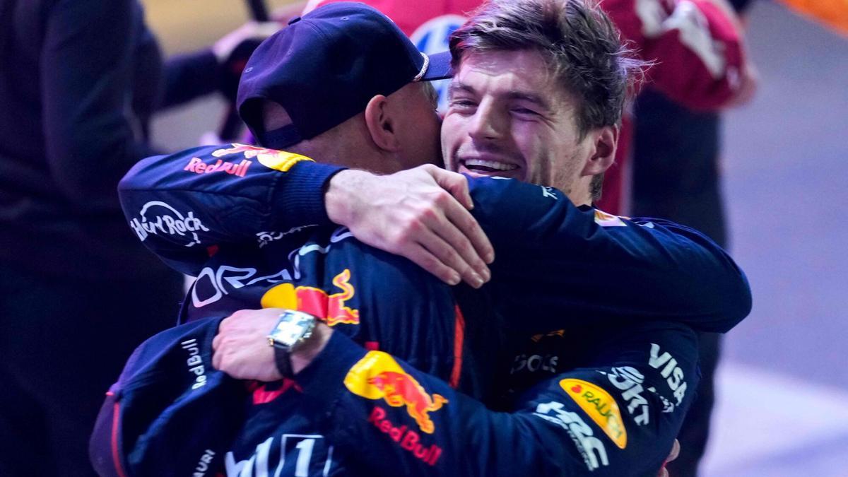 Red Bull Racing's Dutch driver Max Verstappen celebrates with a member of his team after winning the Formula One Qatar Grand Prix at the Lusail International Circuit in Lusail on November 30, 2025.