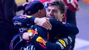 Red Bull Racings Dutch driver Max Verstappen celebrates with a member of his team after winning the Formula One Qatar Grand Prix at the Lusail International Circuit in Lusail on November 30, 2025. (Photo by Altaf Qadri / POOL / AFP)