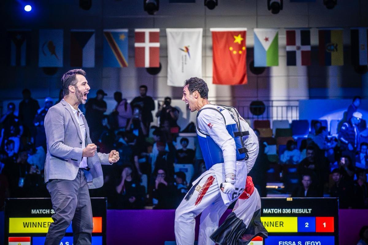 El técnico tinerfeño (i) y el campeón mundial (d).