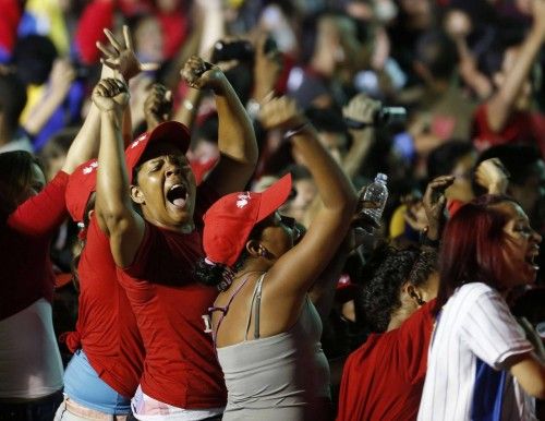 Supporters of Venezuelan presidential candidate Maduro celebrate after the official results gave him a victory in Caracas