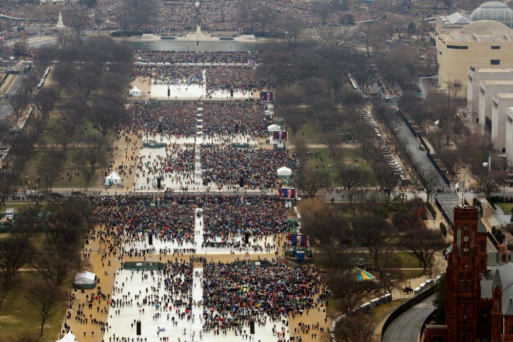 Attendees partake in the inauguration ceremonies ...