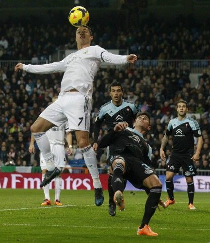 Real Madrid's Cristiano Ronaldo tries to score next to Celta Vigo's David Costas during their Spanish First Division soccer match at Santiago Bernabeu stadium in Madrid