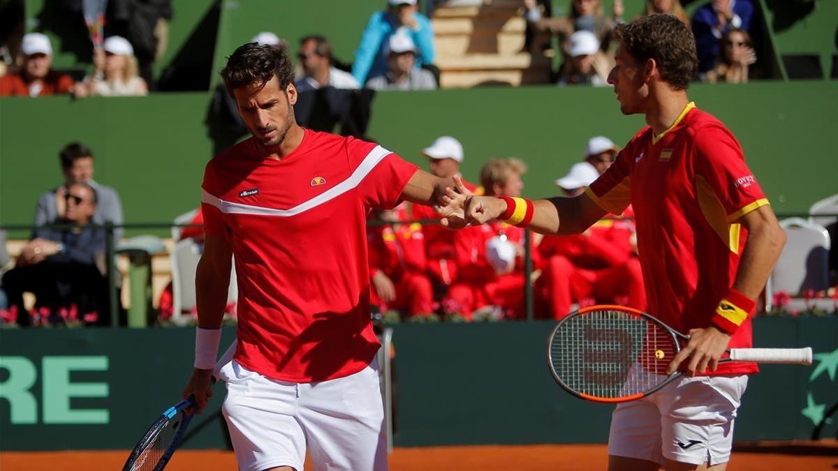 Feliciano López (izquierda) y Pablo Carreño celebran un punto.