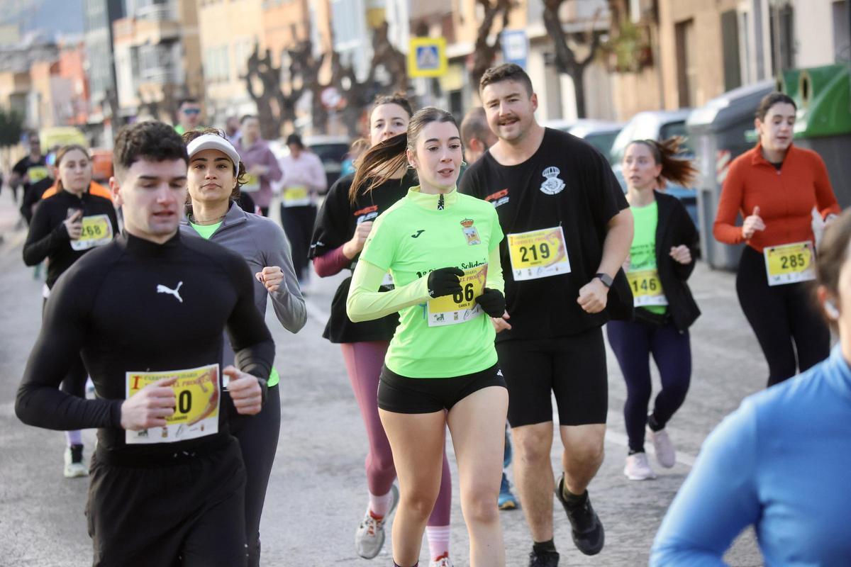 Las imágenes de la carrera popular solidaria en el barrio de El Progreso