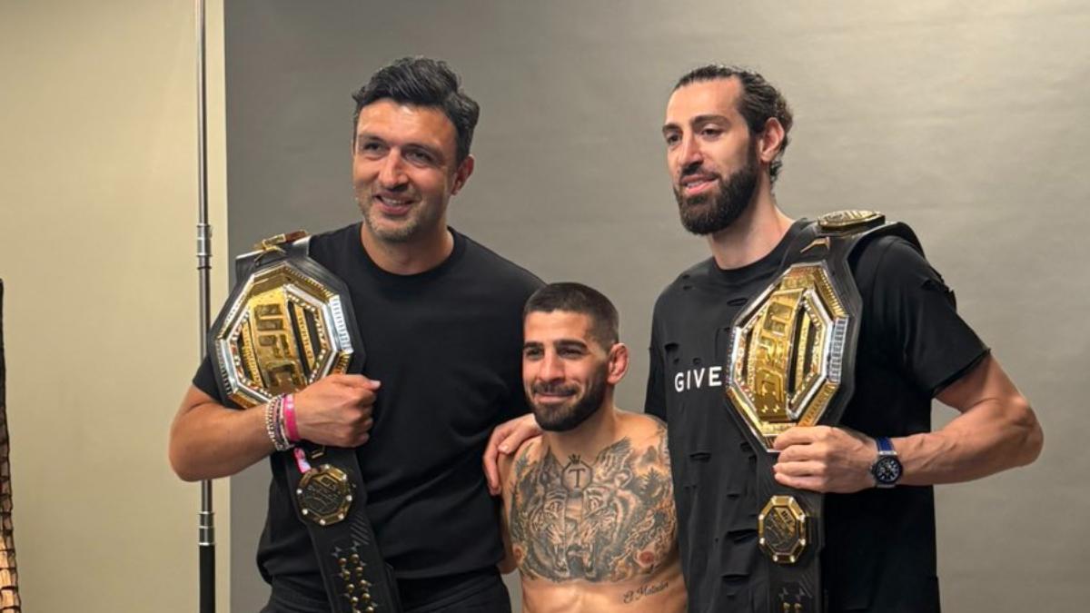Shengelia posa junto a Ilia Topuria y Zaza Pachulia en Las Vegas en el UFC 317