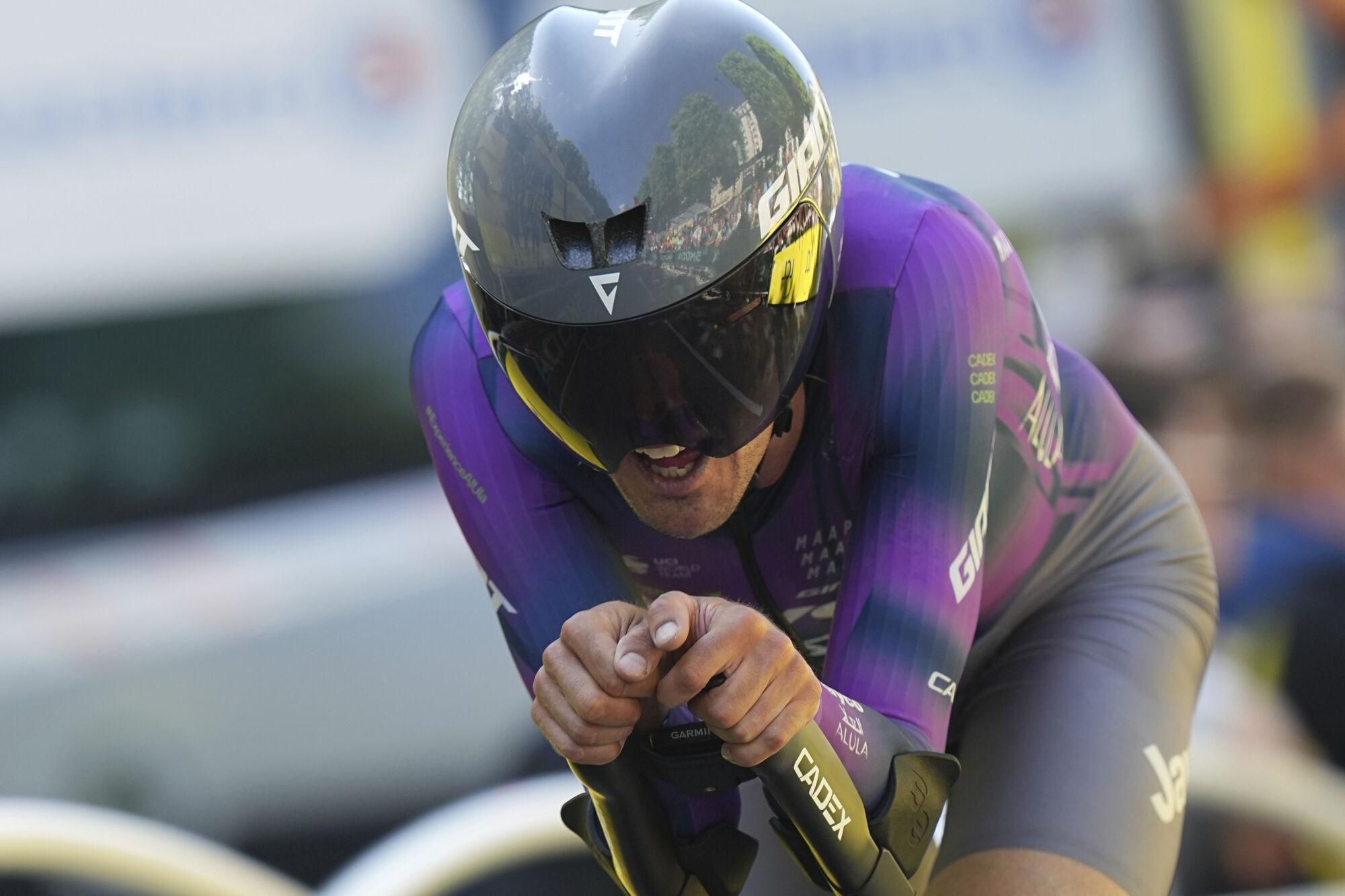 Australia's Ben O'Connor crosses the finish line during the fifth stage of the Tour de France cycling race, an indivdual time-trial over 33 kilometers (20.5 miles) with start and finish in Caen, France, Wednesday, July 9, 2025. (AP Photo/Thibault Camus)