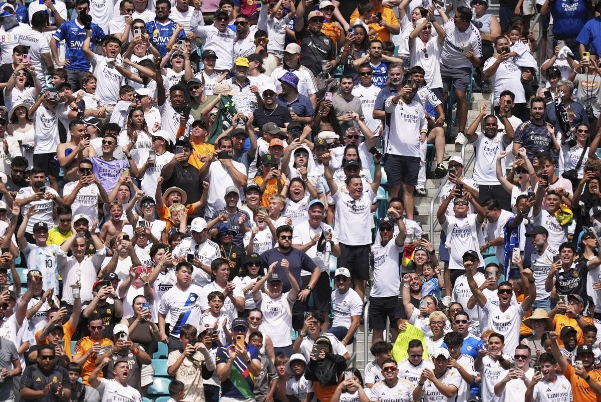 Fans cheer after the opening goal during the Club World Cup group H soccer match between Real Madrid and Al Hilal in Miami Gardens, Fla., Wednesday, June 18, 2025. (AP Photo/Rebecca Blackwell)